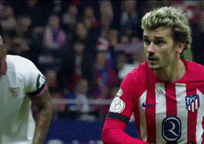 A Soccer Player Wearing A Red And White Striped Jersey With The Number 21 On It . GIF