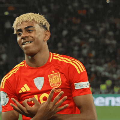 A Soccer Player Wearing A Red And Yellow Jersey With The Number 10 On It GIF