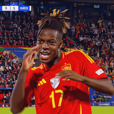 A Soccer Player Wearing A Red And Yellow Jersey With The Number 17 On It GIF