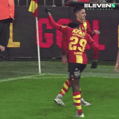 A Soccer Player Wearing A Red And Yellow Jersey With The Number 29 On It GIF