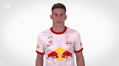 A Soccer Player Wearing A Red Bull Jersey Giving A Thumbs Up GIF