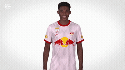 A Soccer Player Wearing A Red Bull Jersey Is Making A Funny Face GIF