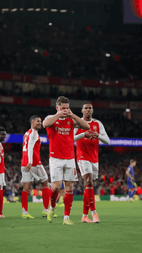 A Soccer Player Wearing A Red Emirates Fly Emirates Jersey GIF