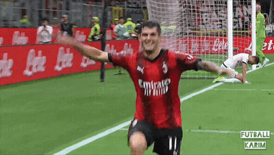 A Soccer Player Wearing A Red Emirates Jersey Celebrates GIF