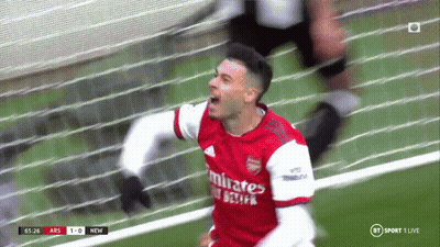 A Soccer Player Wearing A Red Emirates Jersey Celebrates GIF