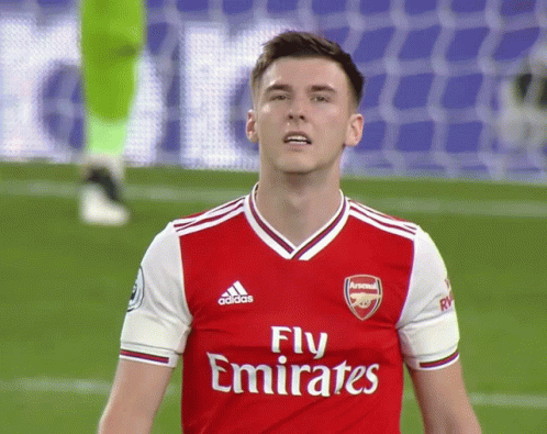 A Soccer Player Wearing A Red Jersey That Says Fly Emirates On It GIF