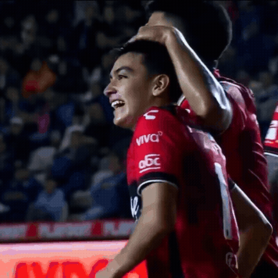A Soccer Player Wearing A Red Jersey That Says Viva On It GIF