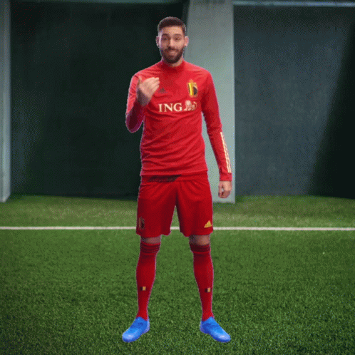 A Soccer Player Wearing A Red Jersey With Ing On The Front GIF