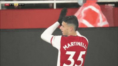 A Soccer Player Wearing A Red Jersey With Martinelli 35 On It GIF