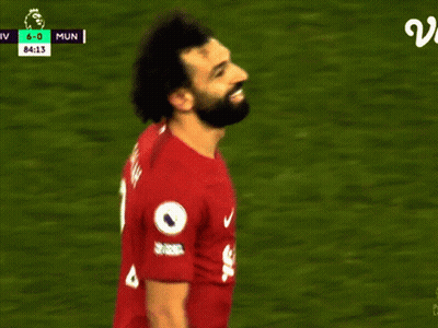 A Soccer Player Wearing A Red Jersey With Salah On It GIF