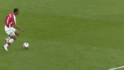 A Soccer Player Wearing A Red Jersey With The Name Alvarez On The Back Is Kicking The Ball GIF