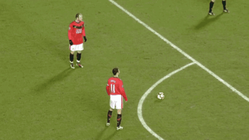 A Soccer Player Wearing A Red Jersey With The Number 11 On It GIF