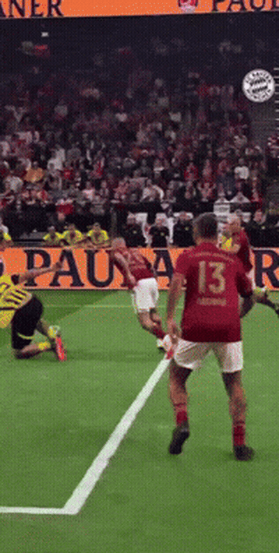 A Soccer Player Wearing A Red Jersey With The Number 13 On It GIF