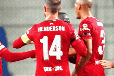 A Soccer Player Wearing A Red Jersey With The Number 14 On It GIF