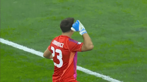A Soccer Player Wearing A Red Jersey With The Number 23 On The Back GIF