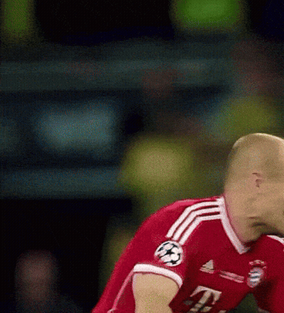 A Soccer Player Wearing A Red Jersey With The Number 4 On The Sleeve GIF