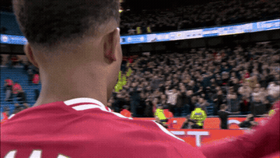 A Soccer Player Wearing A Red Jersey With The Number 44 On It GIF