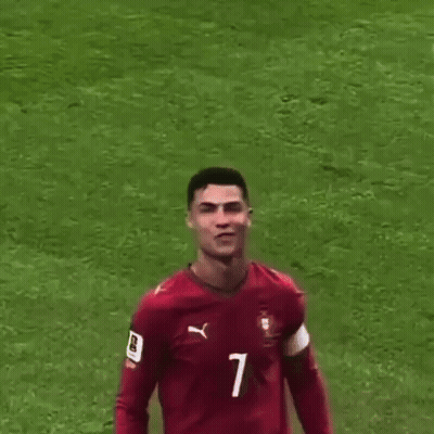 A Soccer Player Wearing A Red Jersey With The Number 7 On It Is Being Pointed At By A Person . GIF