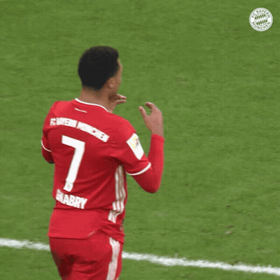 A Soccer Player Wearing A Red Jersey With The Number 7 On The Back GIF