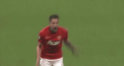 A Soccer Player Wearing A Red Jersey With The Number 8 On It Is Kneeling Down On The Field . GIF