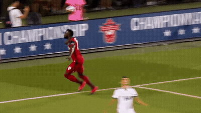 A Soccer Player Wearing A Red Jersey With The Number 8 On It GIF