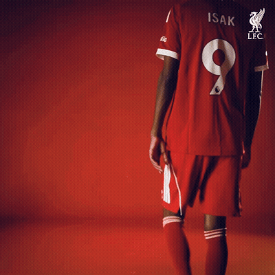 A Soccer Player Wearing A Red Jersey With The Number 9 On It GIF