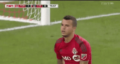 A Soccer Player Wearing A Red Jersey With The Word Mo On The Front GIF