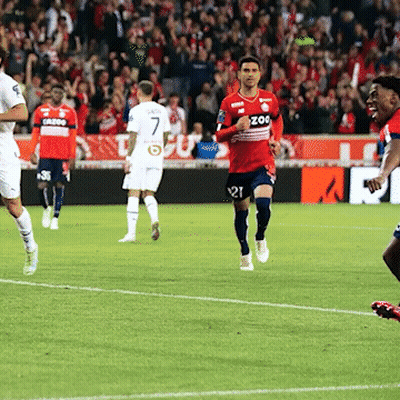 A Soccer Player Wearing A Red Jersey With Zoo On The Front GIF
