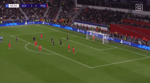 A Soccer Player Wearing A Red Qatar Jersey Is Pointing At Something GIF