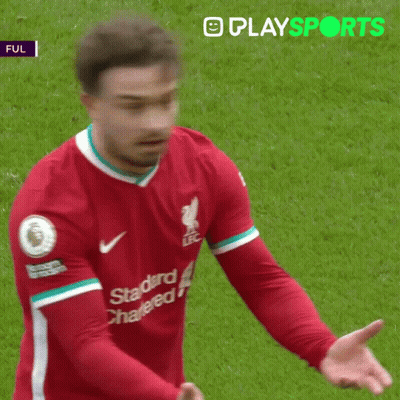 A Soccer Player Wearing A Red Shirt That Says Standard Chartered GIF