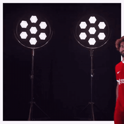 A Soccer Player Wearing A Red Shirt That Says Standard Chartered On It GIF