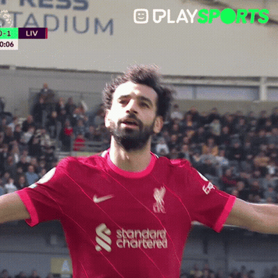 A Soccer Player Wearing A Red Shirt That Says Standard Chartered On It GIF