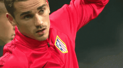 A Soccer Player Wearing A Red Shirt With The Letters Atm On It Is Standing On A Field . GIF