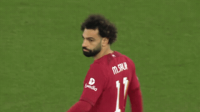 A Soccer Player Wearing A Red Shirt With The Number 11 On The Back GIF