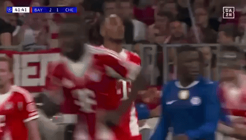 A Soccer Player Wearing A Red T-Mobile Jersey Is Celebrating A Goal GIF