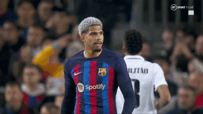 A Soccer Player Wearing A Spotify Jersey Stands In Front Of A Crowd GIF