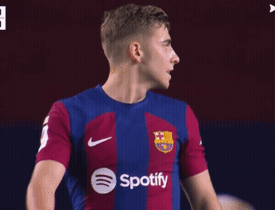A Soccer Player Wearing A Spotify Shirt Looks To His Left GIF