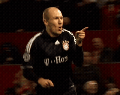 A Soccer Player Wearing A T-Mobile Jersey Is Celebrating A Goal During A Game . GIF