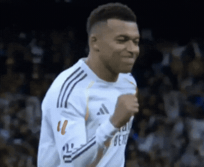 A Soccer Player Wearing A White Adidas Jersey Is Celebrating GIF