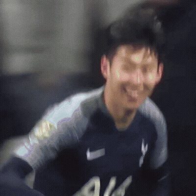 A Soccer Player Wearing A White All Jersey Kicks A Ball GIF
