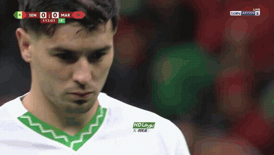 A Soccer Player Wearing A White And Green Shirt With Hd Written On The Front GIF