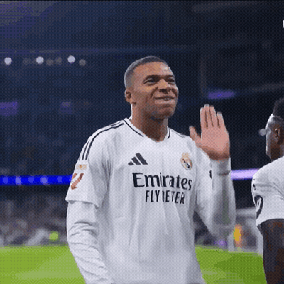 A Soccer Player Wearing A White Emirates Fly Beter Jersey GIF