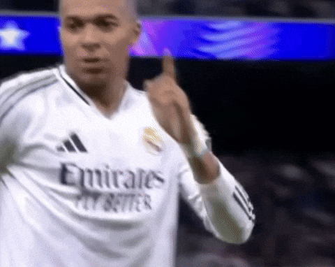 A Soccer Player Wearing A White Emirates Fly Better Shirt GIF