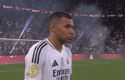 A Soccer Player Wearing A White Emirates Jersey GIF