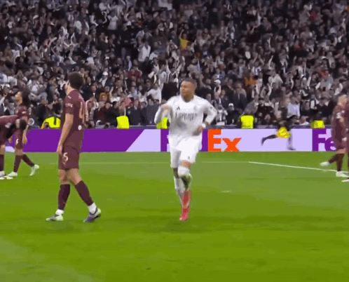 A Soccer Player Wearing A White Emirates Jersey Runs On The Field GIF