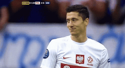 A Soccer Player Wearing A White Jersey With A Red Eagle On The Front GIF