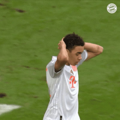 A Soccer Player Wearing A White Jersey With A Red T On It GIF