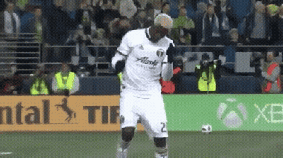 A Soccer Player Wearing A White Jersey With Alaska On The Front GIF