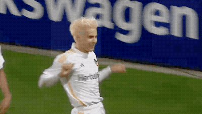 A Soccer Player Wearing A White Jersey With Herbalife On It GIF