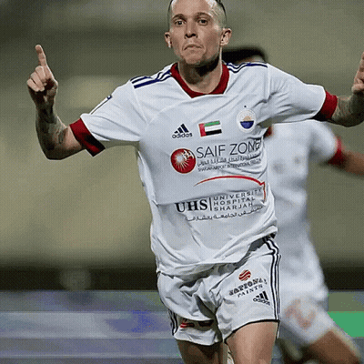 A Soccer Player Wearing A White Jersey With Safe Zone Written On It GIF
